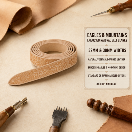 Eagles & Mountains embossed natural vegetable-tanned leather belt blank in a neat coil, available in 32mm and 38mm widths, displayed with leathercraft tools and natural leather.