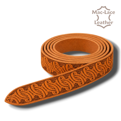 Celtic embossed cognac vegetable-tanned leather belt blank in 32mm and 38mm widths, displayed with leathercraft tools and an antique-brass buckle.