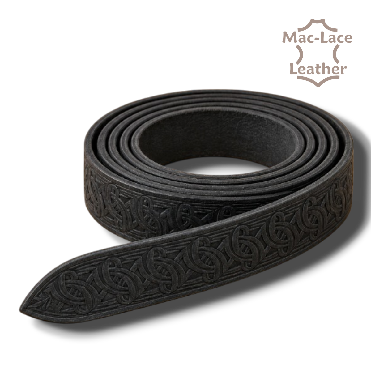 Celtic embossed black vegetable-tanned leather belt blank in 32mm and 38mm widths, displayed with leathercraft tools and an antique-brass buckle.